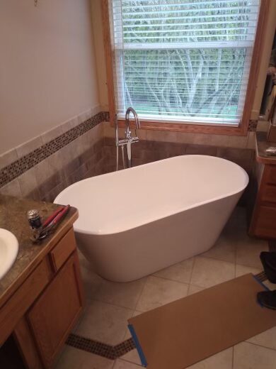 Freestanding bathtub installation by Clark Plumbing