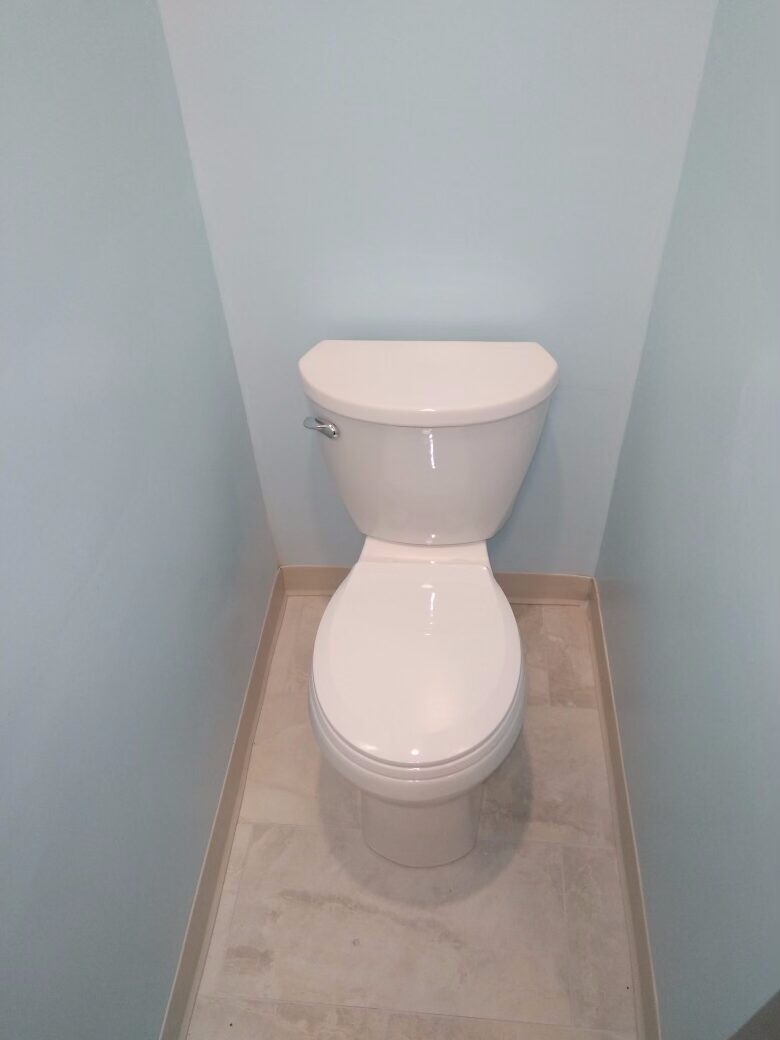 Bathroom toilet fixture installation by Clark Plumbing